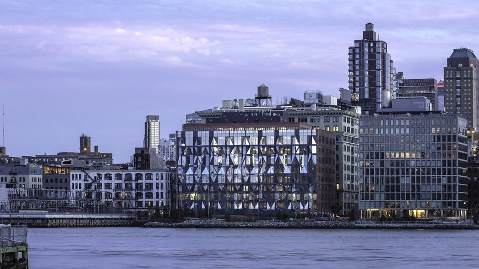 New York ODA converts a brickyard into a hub for creative people, replacing the main façade with a permeable structure made of glass and steel.